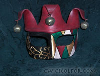 A harlequin-patterned Columbina Jester with a three-pointed belled hood.